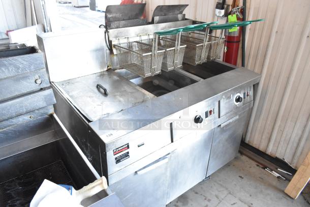 Frymaster FM245ESC stainless steel 2-bay natural gas fryer with dumping station, 4 fry baskets, on casters, 122,000 BTU.