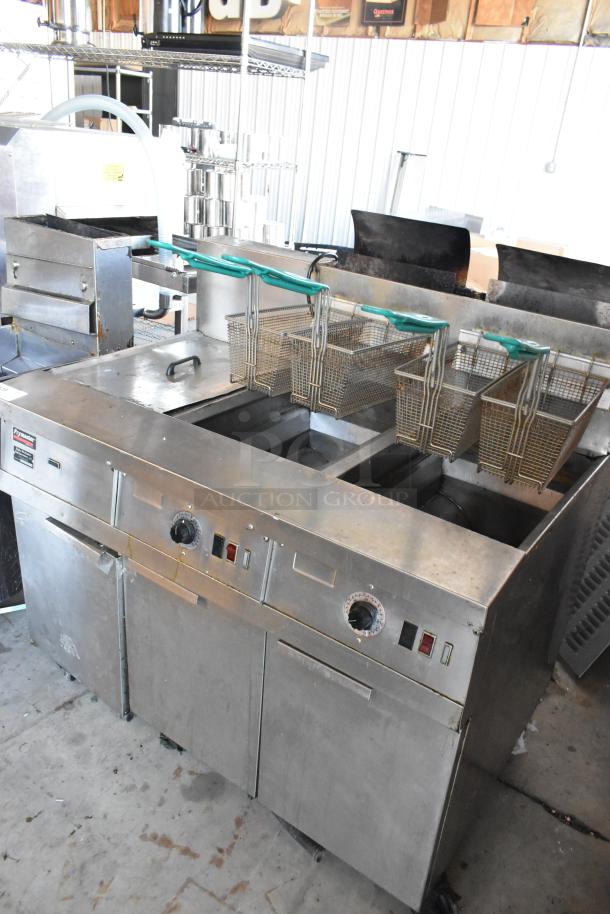 Frymaster FM245ESC stainless steel commercial 2-bay deep fryer, natural gas, 4 baskets, dumping station, on casters, 122,000 BTU.
