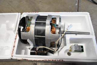 Brand new Robot Coupe 303160S motor assembly for R2 series, in original packaging, visible wires and components.
