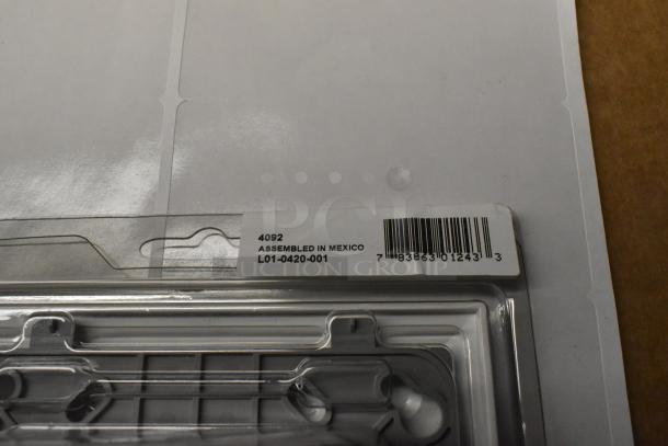 Alt text: Packaging with label showing "4092 Assembled in Mexico L01-0420-001," part of new fire alarm pull down boxes set.