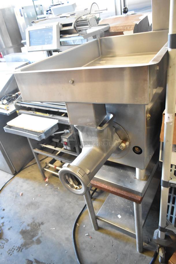 Hobart 4732 commercial meat grinder, metal construction, 208 volts, 1 phase. Good condition with hopper and feed chute.