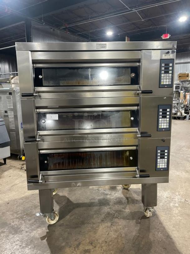 Doyon 2T3 commercial stainless steel triple deck oven, 2017 model, electric, 6-pan, digital controls, 208V 3-phase, on casters.