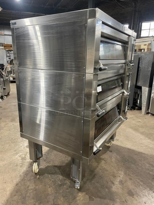 Doyon 2T3 commercial stainless steel triple deck oven, 6-pan capacity, digital controls, on casters, late model, good condition, 208V 3 phase.