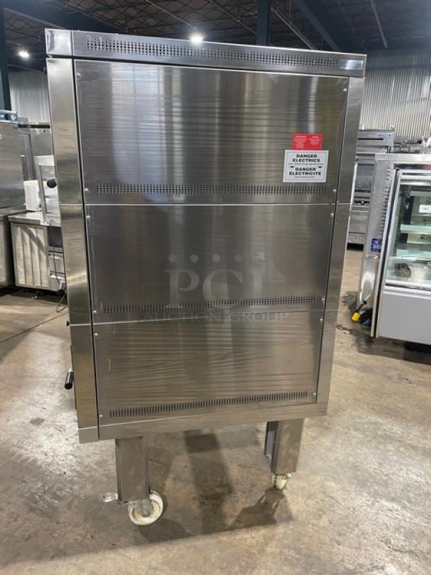 Commercial Doyon 2T3 stainless steel triple deck oven, electric, digital controls, 6-pan capacity, on casters.