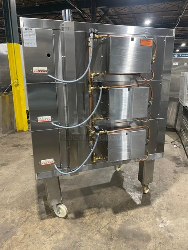 Doyon 2T3 stainless steel electric 6-pan artisan stone triple deck oven on casters, 208V 3 phase, with digital controls, SN: 884910000517.