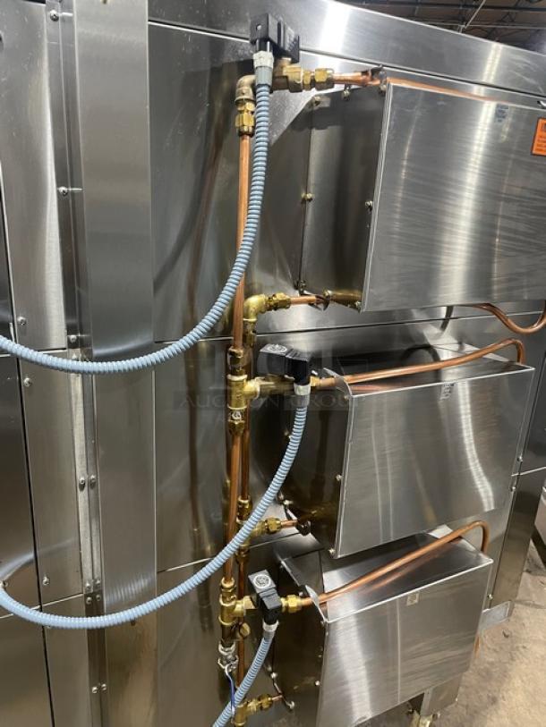 Doyon 2017 commercial stainless steel 6-pan triple deck oven, model 2T3, with digital controls, 208V 3 phase, on casters.