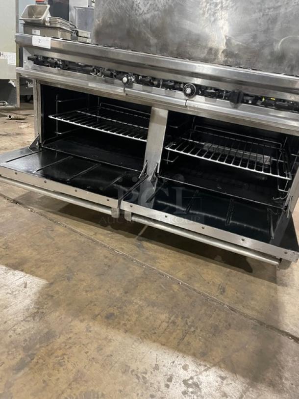 Therma Tek stainless steel 10-burner range with double oven, backsplash, wired racks, and casters; natural gas powered.