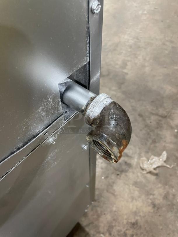 Imperial commercial stainless steel range; natural gas connection detail, part of 4-burner, griddle, double oven combo.