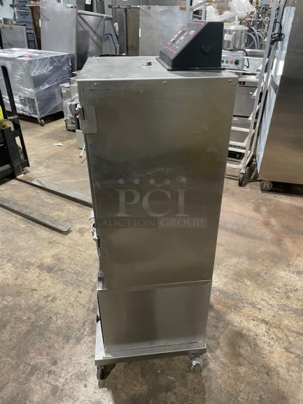 Cookshack SM066 commercial stainless steel smoker oven, 2014 model, with digital controls, wired rack, on casters.