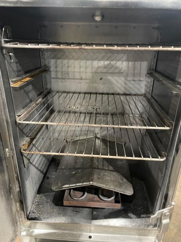 Cookshack SM066 stainless steel electric smoker oven, 2014 model, digital controls, wired racks, enclosed base, on casters.