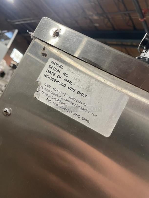 Cookshack SM066 stainless steel electric smoker oven, 2014 model, with digital controls and wired rack, serial number 5117, on casters.