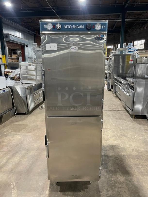 Alto-Shaam stainless steel dual-compartment Dutch door cabinet, Model 1200UPSR, on casters, with upper & lower controls.