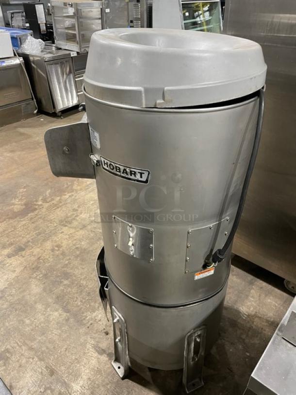 Hobart 6460C commercial potato peeler, 60 lb. capacity, 115V, on legs with stand, stainless steel, label visible, good condition.