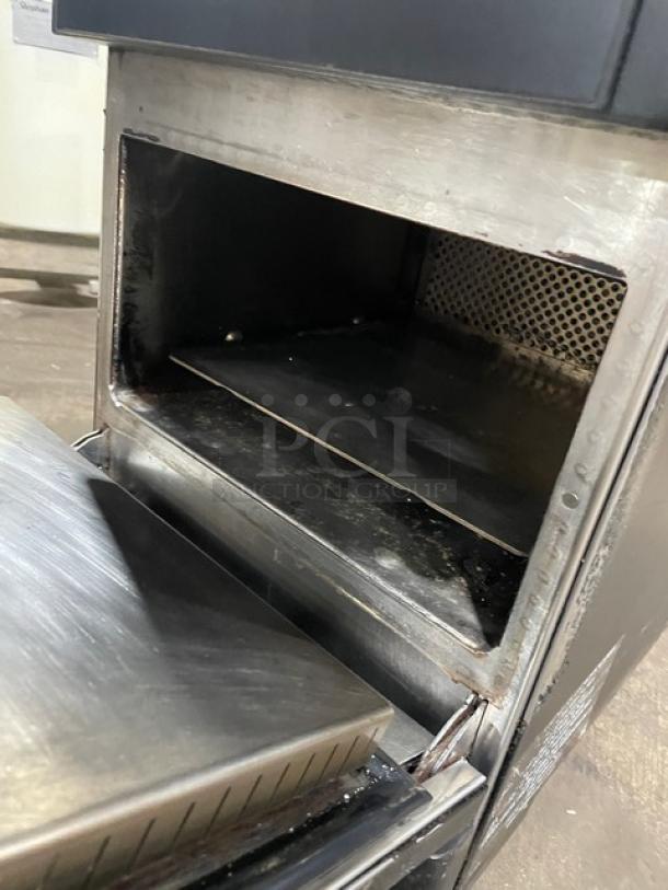 MerryChef Eikon E2S commercial rapid cook oven, black, countertop, 208/240V 1 phase, visible wear, open door view.