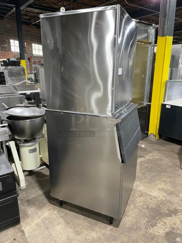 Hoshizaki KM-901MRJ stainless steel ice maker/storage bin; electric, remote-cooled, Energy Star certified, on legs.