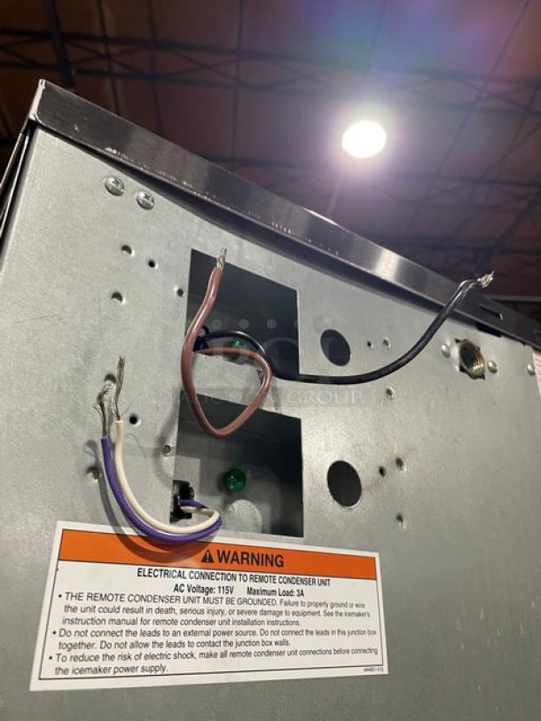 Hoshizaki KM-901MRJ ice maker head, stainless steel, remote-cooled, Energy Star certified, 208-230V, with warning label.