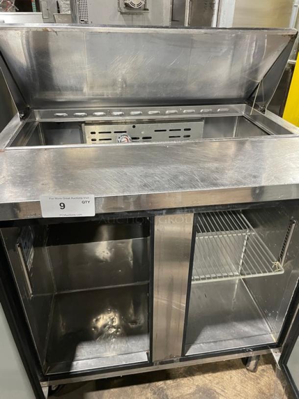 Turbo Air MST-36 stainless steel 2-door refrigerated prep table, poly-coated wire rack, 115V, on casters, excellent condition.