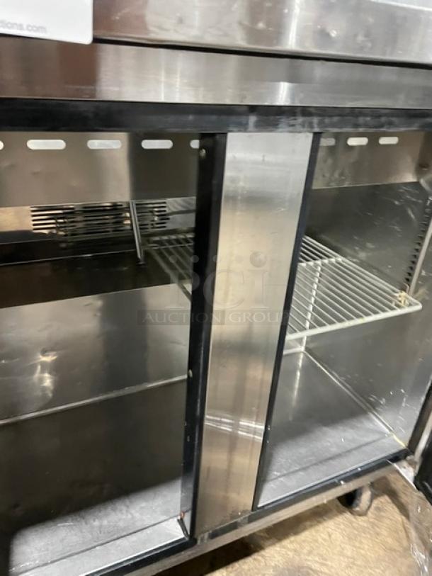 Turbo Air MST-36 commercial stainless steel 2-door refrigerated prep table, featuring poly-coated wire rack, 115V, on casters.