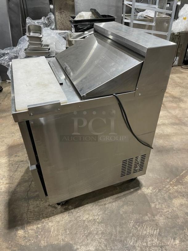 Everest EPBNR1 stainless steel 2-drawer refrigerated prep table with cutting board, on casters, 115V, 1 phase.