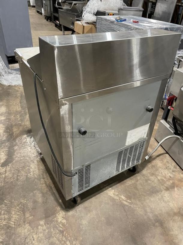Everest EPBNR1 stainless steel refrigerated salad prep table, 2 drawers, cutting board, on casters, used condition.