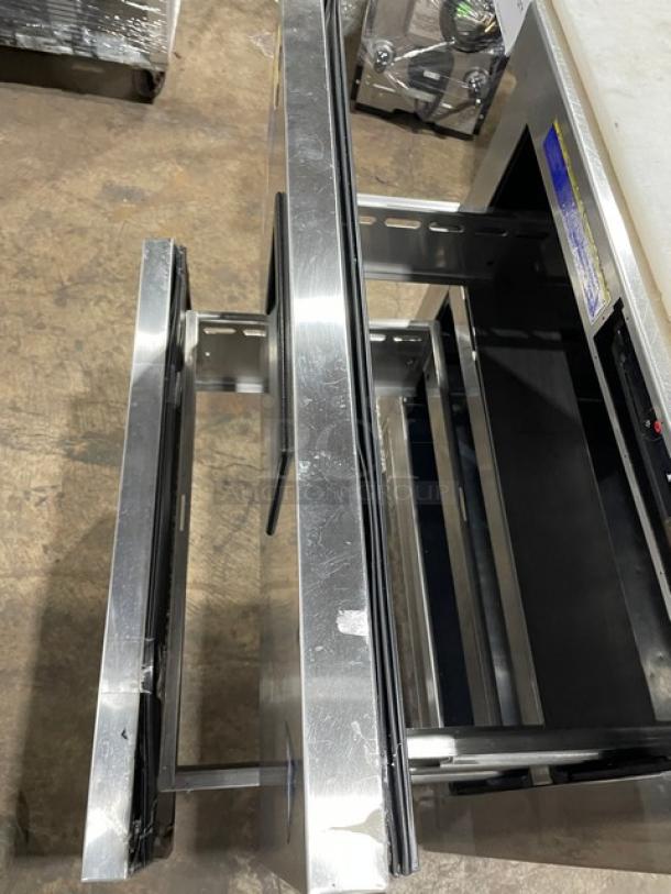 Everest EPBNR1 stainless steel refrigerated prep table with 2 drawers, bain marie style, cutting board, on casters.