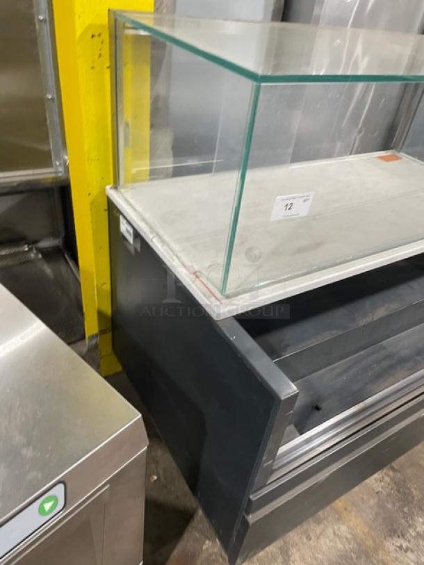 Structural Concepts black multi-level refrigerated open grab-n-go merchandiser display case with upper enclosed-glass showcase, on legs.