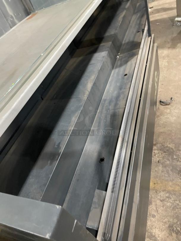 Structural Concepts black multi-level refrigerated display case, open grab-n-go style, upper glass showcase, on legs.