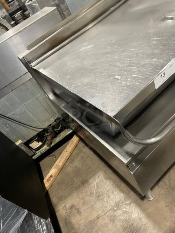 Cleveland Range 48" stainless steel electric braising pan with swivel spout faucet. Good condition, on legs, working when removed.