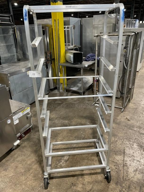 Channel SRS-7 aluminum slanted display rack on casters, commercial-grade, five shelves, with visible model label.