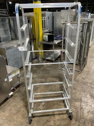 Channel SRS-7 aluminum slanted display rack on casters, commercial-grade, five shelves, with visible model label.