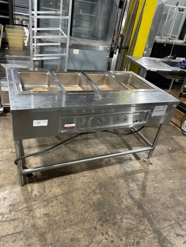 Wells MOD400TDM 4-Well Stainless Steel Steamtable, electric powered, top-mount, 208/240V, on legs, excellent condition.