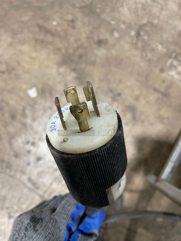 Electric plug for Wells MOD400TDM steam table. Visible markings: "30A 250V." Clean condition for commercial use.