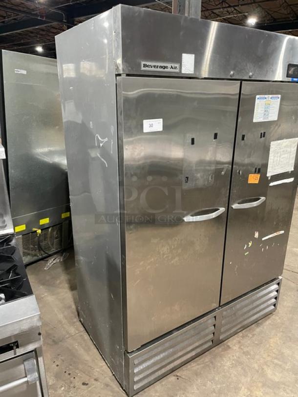 Beverage-Air KF48-1AS commercial 2-door stainless steel freezer, poly-coated wire racks, model and SN labels visible.