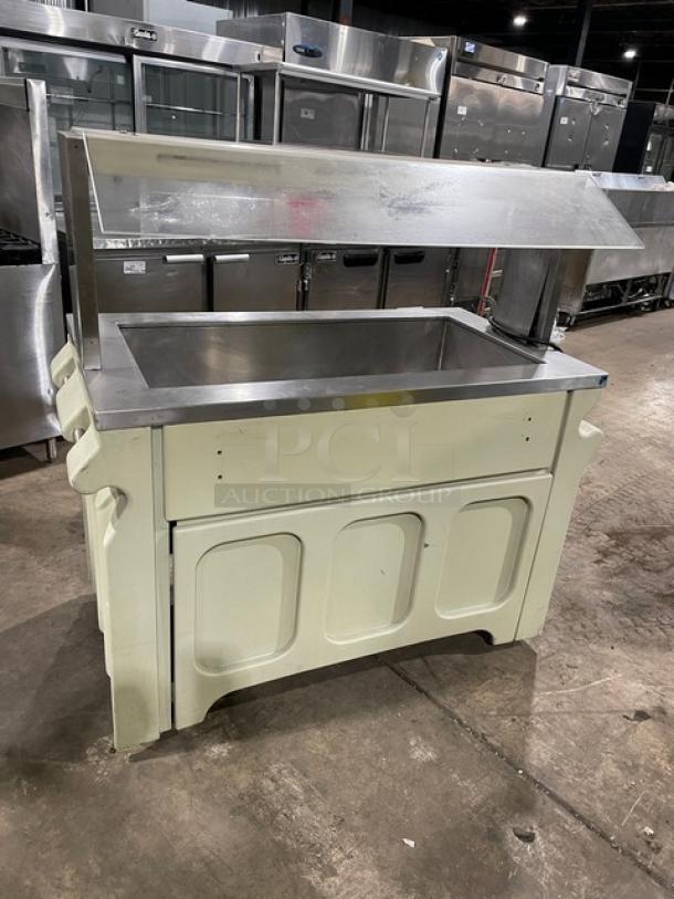 Custom stainless steel buffet-style refrigerated salad bar with sneeze guard, folding tray slide, and casters.