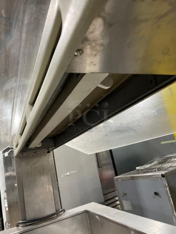 Stainless steel refrigerated cold food/salad bar with sneeze guard, folding tray slide, on casters, portable.