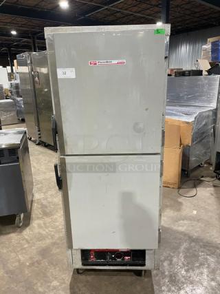 Metro Flavor Hold Series half-door heated cabinet, model C199-H(1)N, on casters, with wide pan slides, in used condition.