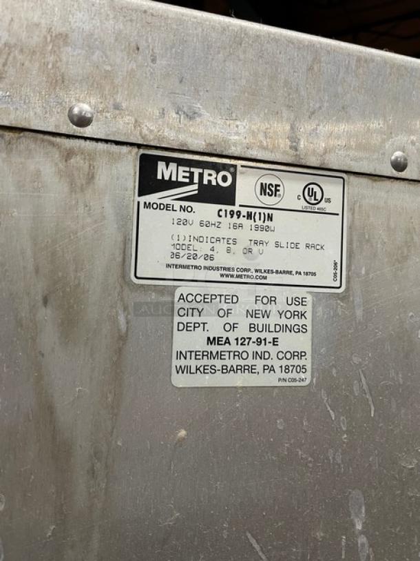 Metro C199H1N half door holding/proofing cabinet; stainless steel with labels; NSF, UL listed; 120V; on casters; used condition.