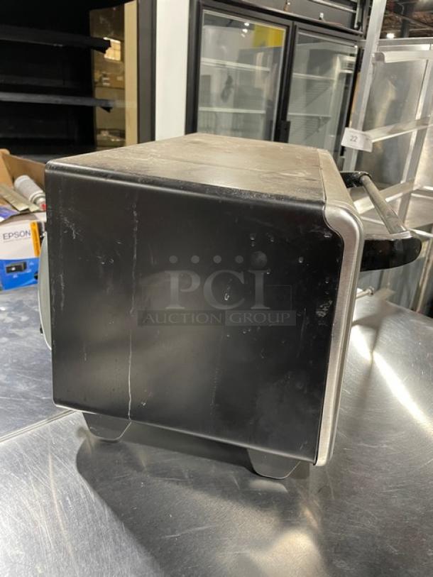 BLACK+DECKER TO3250XSB stainless steel convection toaster oven, extra wide, electric, on legs, side view, used condition.