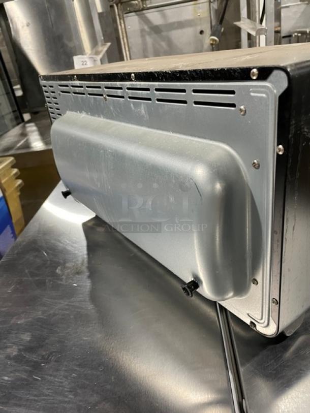 BLACK+DECKER TO3250XSB extra wide stainless steel convection toaster oven, featuring rear side with ventilation and power cord.