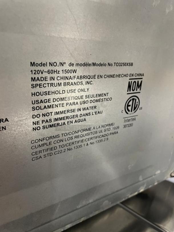 BLACK+DECKER TO3250XSB 120V toaster oven label showing model, power specifications, manufacturer, and safety warnings.