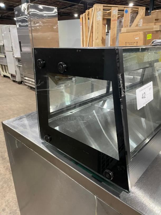 Turbo Air black sushi display case with stainless interior, rear sliding doors; SN: H2SAS50D1024.