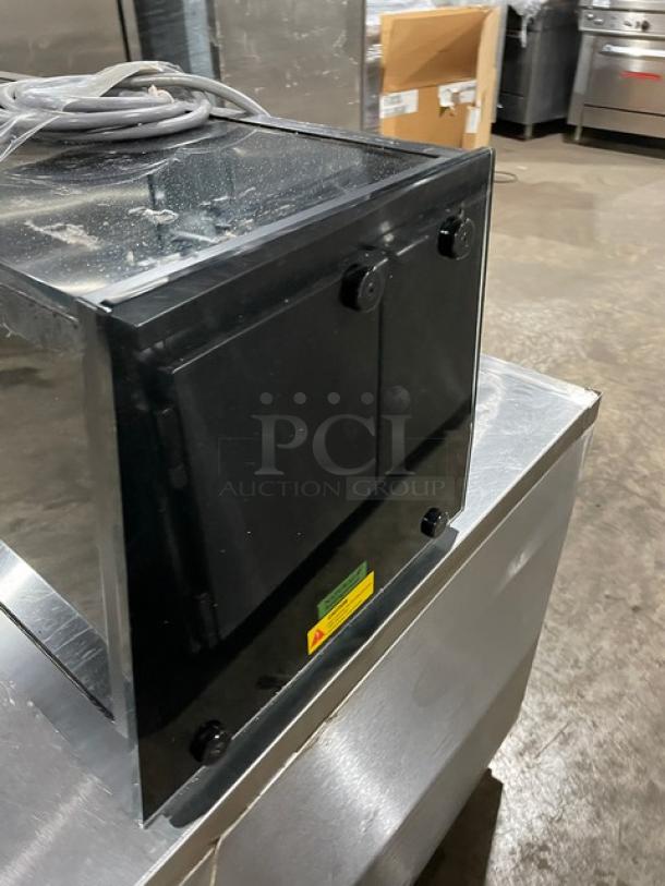 Turbo Air black refrigerated countertop sushi merchandiser with stainless steel interior, rear double sliding doors. SN: H2SAS50D1024.