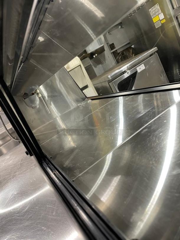 Turbo Air refrigerated sushi display with stainless steel interior, rear sliding doors, and SN: H2SAS50D1024.