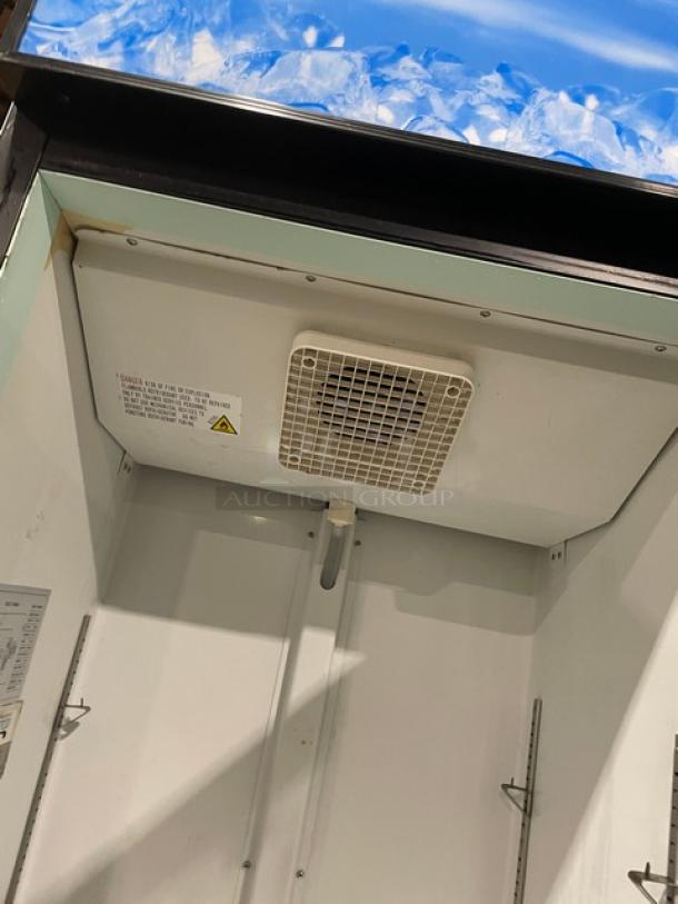 Avantco commercial refrigerator interior, model 178GDC15HCB. Features poly coated wire rack, LED lighting, and visible labels.