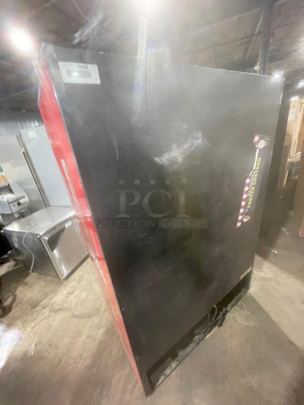 True GDM-49 black double glass swing door merchandiser refrigerator with poly-coated wired rack, commercial use.