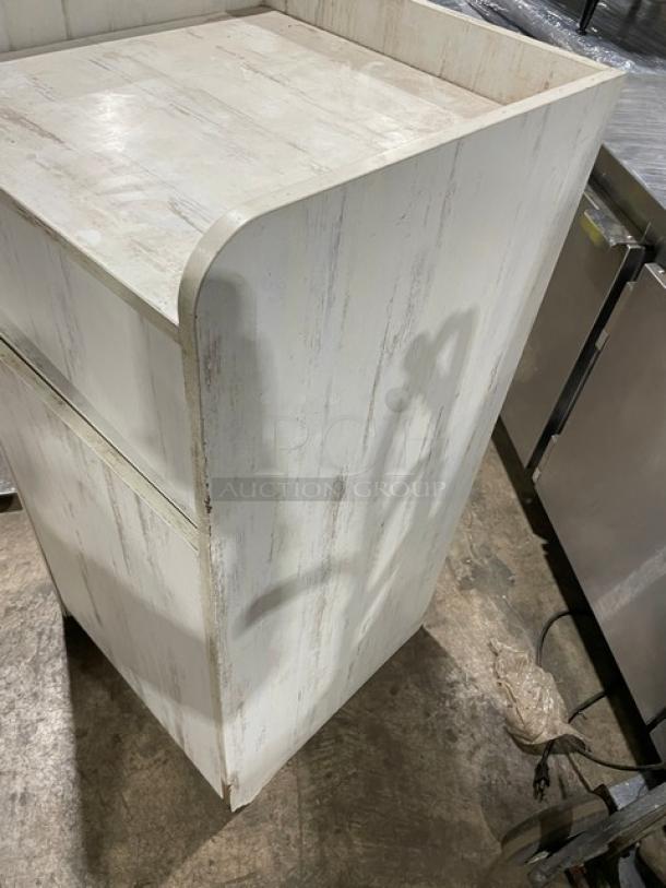 Commercial wooden enclosed trash cabinet, rustic finish, moderate wear, ideal for businesses, no visible labels or tags.