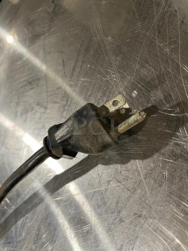 Vita-Mix VM0126 power cord with standard three-prong plug, slightly worn. Part of a commercial blender system.