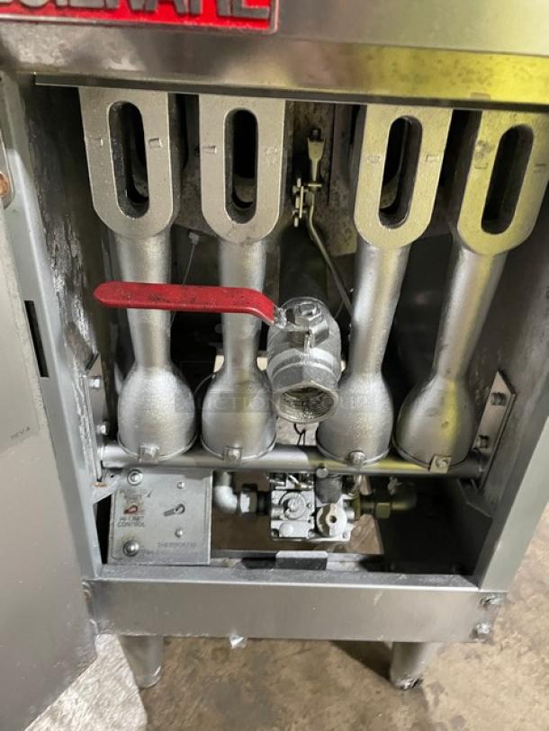 Cecilware FMP40 commercial stainless steel deep fat fryer, natural gas, 43 lb. capacity, with backsplash, fry basket, and on legs.