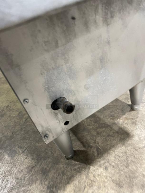 Cecilware FMP40 stainless steel deep fat fryer, natural gas, 43 lb capacity, with backsplash and fry basket, on legs.