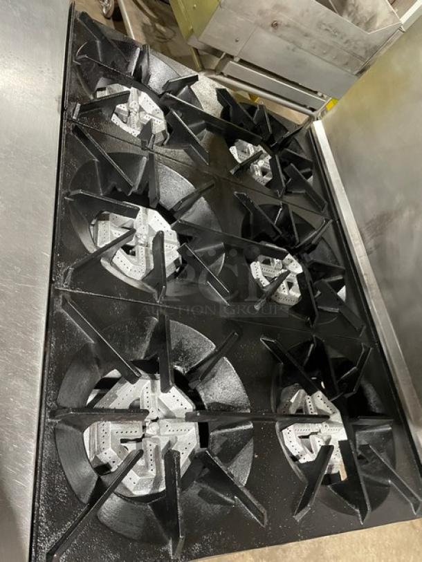 Sunfire by Garland stainless steel 6-burner range/oven combo with U.S. Range overhead salamander. Model SX-6-26, on casters.